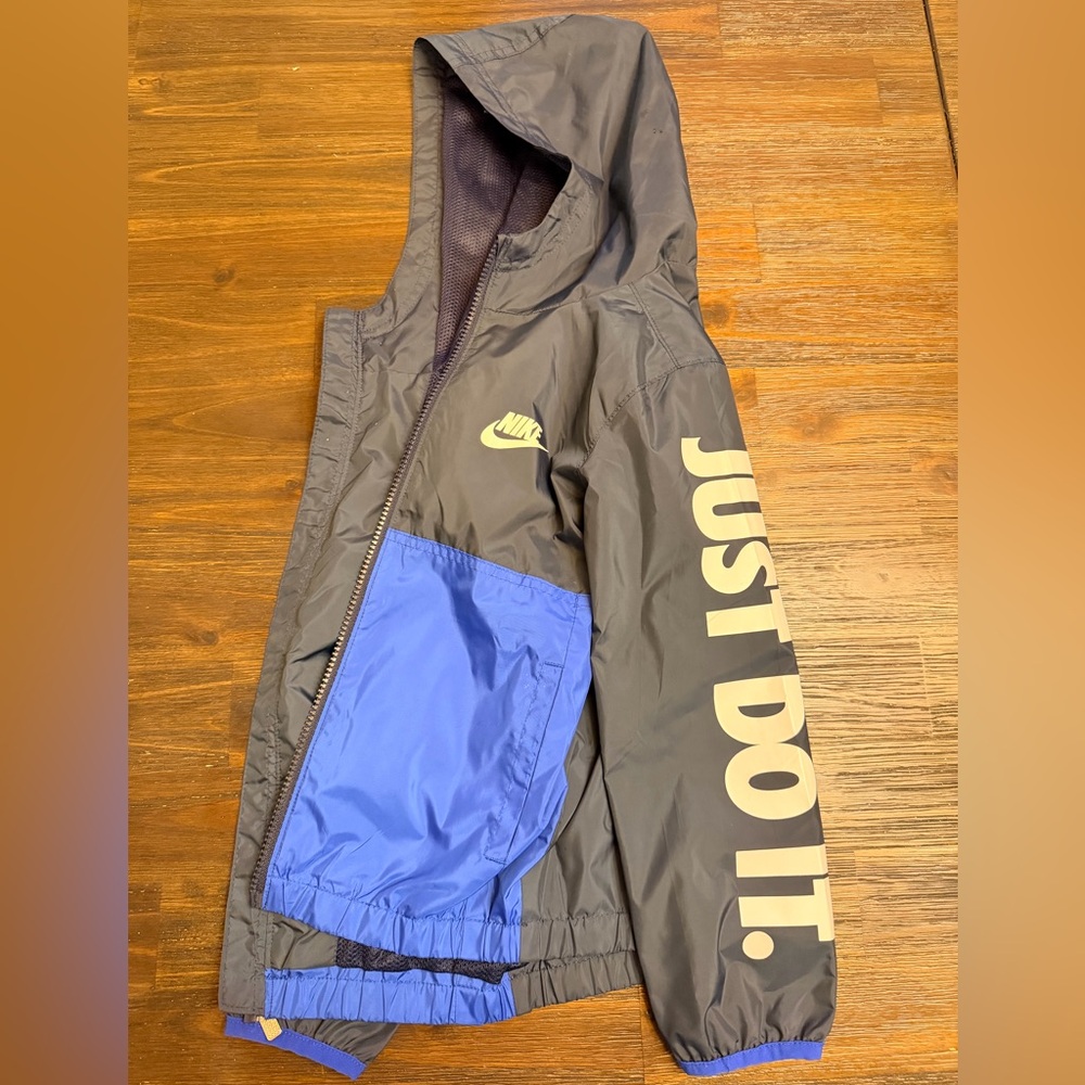 Nike Kids Hooded Jacket in Black and Blue with 'Just Do It.' Sleeve